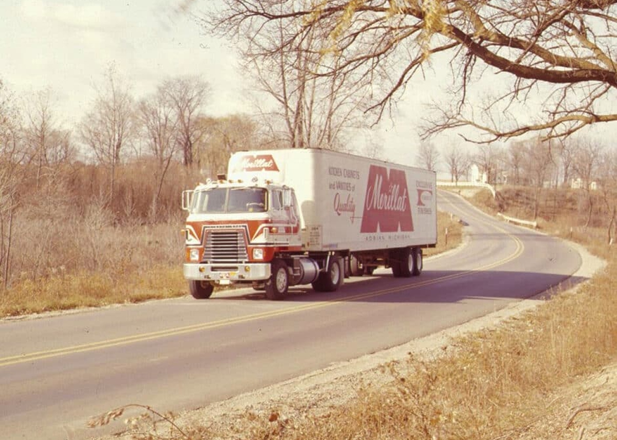 1980s Merillat truck driving down road