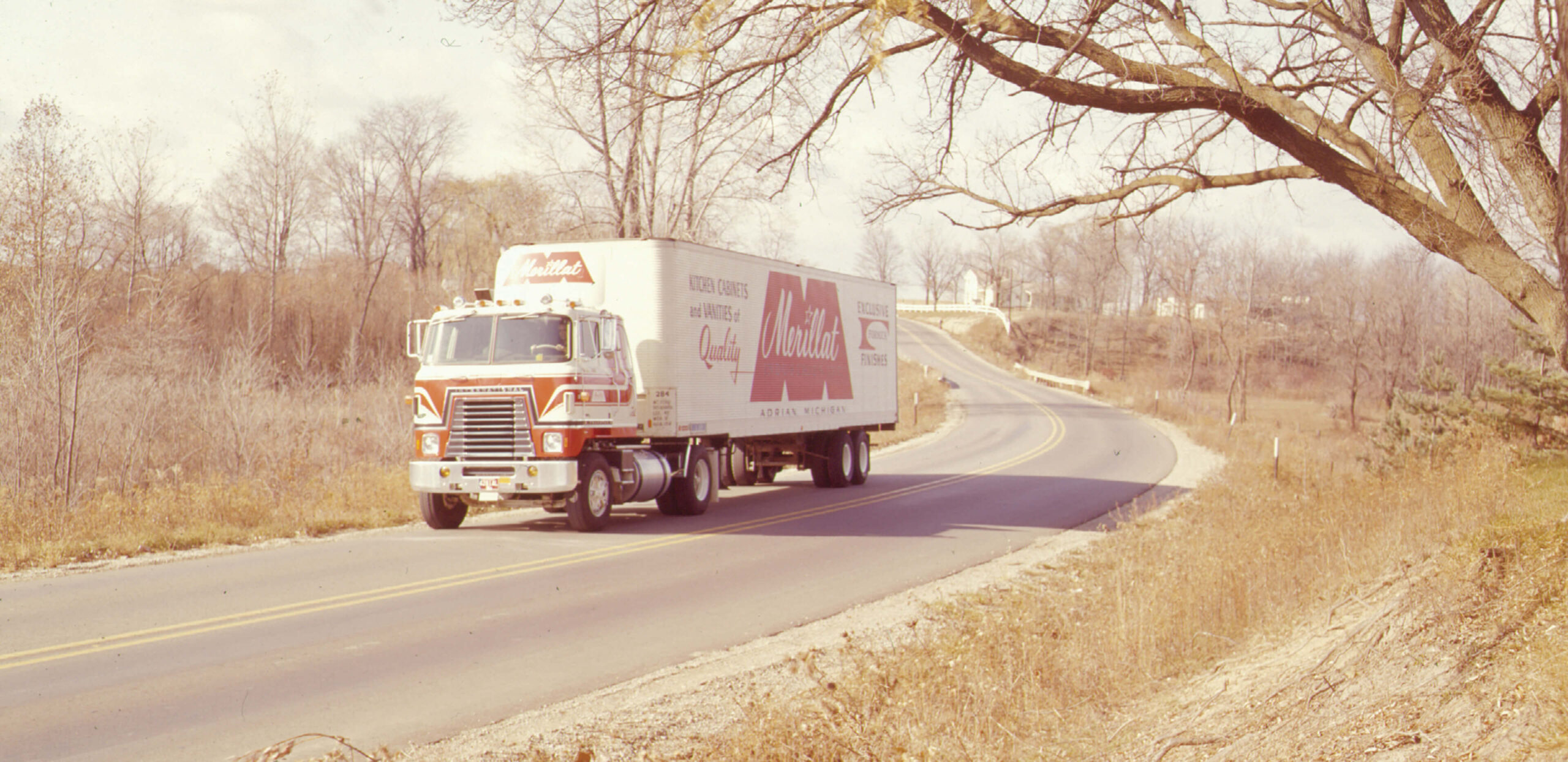 Older image of Merillat truck on road in winter